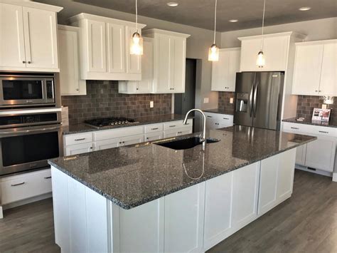 white cabinets with steel gray granite|granite countertops on white cabinets.